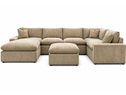 A large, plush gray sectional sofa with a matching ottoman is displayed in a showroom. A sign above reads, MY CLOUD: The Worlds Greatest & Most Comfortable Sofa. A bison image is in the background.