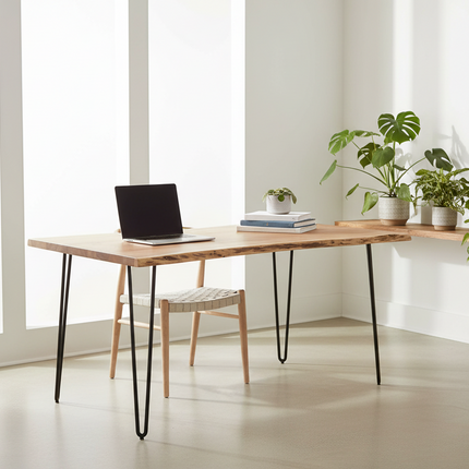 Live Edge Hairpin desk staged in a bright minimalist home office with a woven chair, laptop and trailing plants