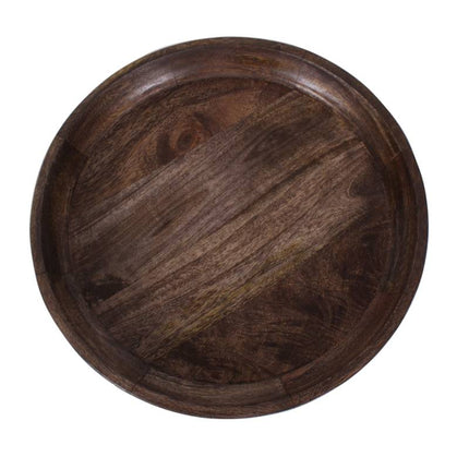 The Mango Bowl Side Table is round and dark, crafted from mango wood with a smooth finish and visible grain patterns. Its shallow depth and subtle edge provide a minimalist, natural look that seamlessly complements mid-century style interiors.