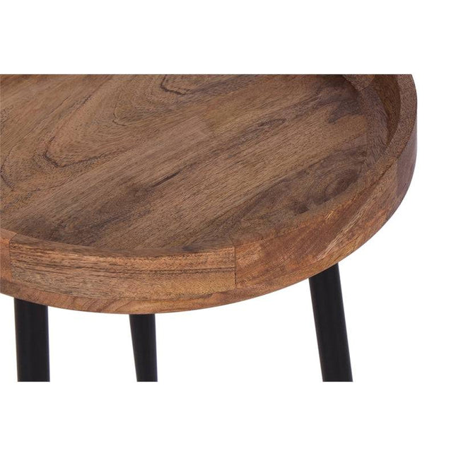 The Mango Bowl Side Table features a round mango wood tabletop with a raised edge that highlights its natural grain. Supported by black metal legs, it adds mid-century flair to any room.