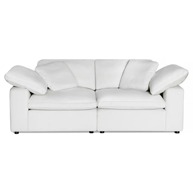 The Peyton 2 Piece Straight is a luxurious white, cushioned two-seater sofa showcasing a smooth, contemporary design. It features plush, slightly reclined backrests and armrests that seamlessly blend with its body, creating a sanctuary of comfort against a plain white background.