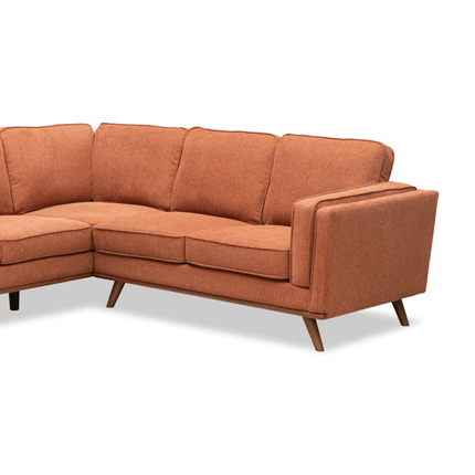 Introducing the Maddox RSF, a mid-century modern piece in burnt orange fabric with clean lines and wooden legs. Its cushioned backrests and seats offer plush comfort, creating a stylish yet cozy seating arrangement for any space.