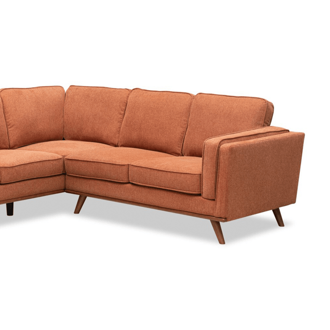 Introducing the Maddox RSF, a mid-century modern piece in burnt orange fabric with clean lines and wooden legs. Its cushioned backrests and seats offer plush comfort, creating a stylish yet cozy seating arrangement for any space.