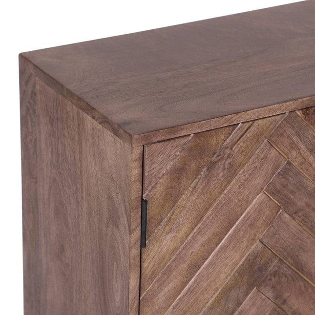 A close-up shot showcases the corner of an Acacia Wooden 2 Door Cabinet With Iron Leg, featuring a herringbone pattern on the door. Made from mango wood and boasting a natural finish that highlights its grain, the cabinets hinge is visible on the side.