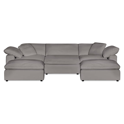 The Peyton 3 Piece Straight + 2 Ottomans is a large gray sectional that epitomizes modern luxury with wide armrests, cushioned seats, soft upholstery, down & feather cushions, and a minimalist design offering adaptability and timeless elegance for any space.
