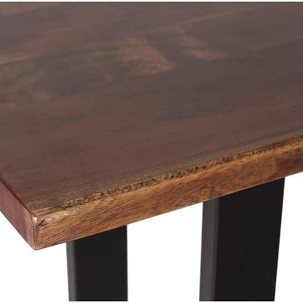 A close-up of the Live Edge Consoles wooden tabletop, crafted from eco-friendly acacia, highlights a rich brown finish with smooth edges and a unique natural grain. Black metal legs support the piece, partially visible at the bottom.