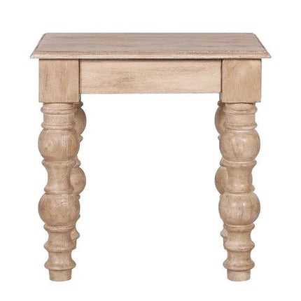 The French Country Side Table is crafted from solid mango wood, featuring a square top and intricately carved thick round legs. Its distressed natural finish adds to its rustic, antique charm, exuding a classic French-country design.