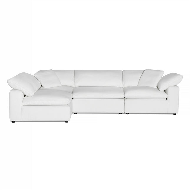The Peyton 4 Piece white sectional sofa radiates luxury with its three seats and left-side extended chaise. Wrapped in smooth fabric and plush cushions, it appears on a plain white background, perfect for enhancing any elegant living space.