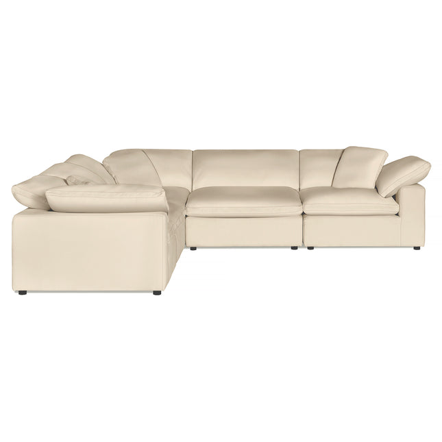 Indulge in luxury with the Peyton 5 Piece L-shaped sectional sofa in cream, boasting plush cushions and wide armrests. Its versatile design perfectly complements various room styles, creating a true sanctuary against a simple white backdrop.