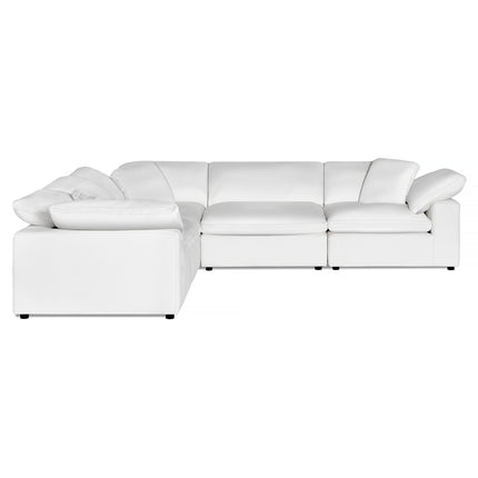The Peyton 5 Piece L sectional, a large white leather sofa with plush cushions, offers luxurious comfort against a plain backdrop. Its right-angle design ensures ultimate adaptability to any space.