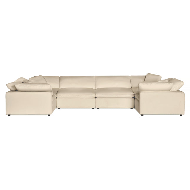 The Peyton 6 Piece Pit is a large beige sectional sofa with three sections, offering ultimate comfort. Its low backrests and matching cushions enhance its modern, cozy look. Set against a white background, it exudes understated luxury that complements any interior setting.