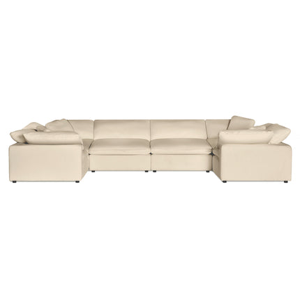 The Peyton 6 Piece Pit is a large beige sectional sofa with three sections, offering ultimate comfort. Its low backrests and matching cushions enhance its modern, cozy look. Set against a white background, it exudes understated luxury that complements any interior setting.