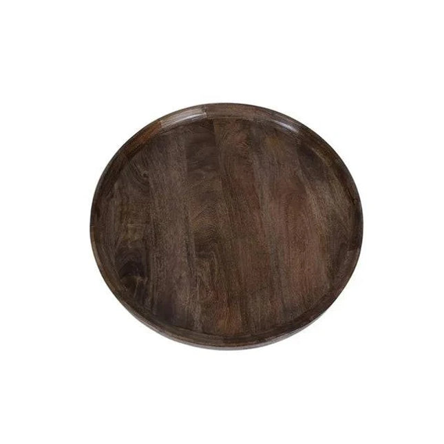 The tray, inspired by the Mango Bowl Coffee Table, features a mid-century style with its round shape, dark wood grain, and smooth finish. Shown top-down on a white background, it boasts a raised edge and echoes the charm of ethically made mango wood furniture.