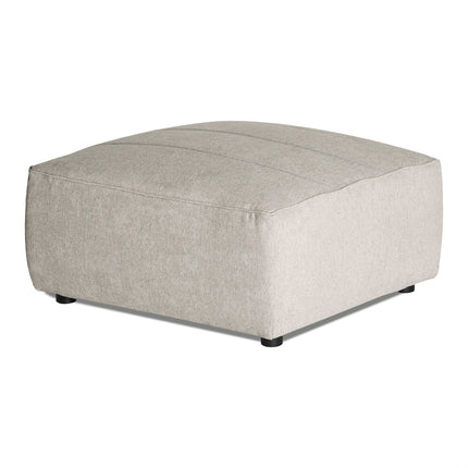 Discover the Millenium Ottoman: a large, square, light gray piece with a sleek fabric finish and subtle stitching. It stands elegantly on small black cylindrical legs, capturing modern luxury in every detail.