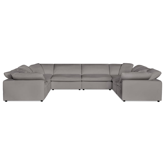 The Peyton 8 Piece Pit, a luxurious large gray U-shaped sectional sofa, features plush cushions and low armrests. It perfectly balances comfort with style, elegantly positioned against a plain white background.