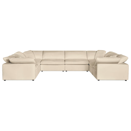 The Peyton 8 Piece Pit luxury sectional is a large, beige, U-shaped sofa with cushioned seats and backs, low armrests, and small black feet. It exudes modern elegance and spacious comfort, balancing style with adaptability for any living space.