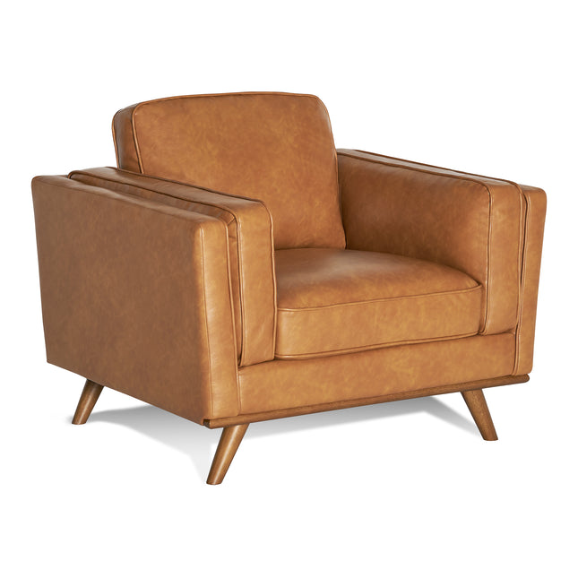 The Maddox Chair is a mid-century modern armchair with a tan leather finish, wooden tapered legs, clean lines, and a boxy shape. Part of the Maddox Sofa Set, it offers plush cushions for enhanced comfort.