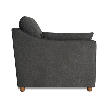 The My Cloud Slope Chair in dark gray has a gently sloped backrest, single cushion, wooden legs, and minimalist design, blending customizable comfort with modern elegance against a plain white backdrop.