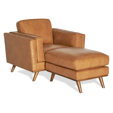 The Maddox Chair is a mid-century modern chaise lounge in brown faux leather, featuring angular armrests, a tufted backrest, and tapered wooden legs. Its sleek design blends comfort and style, making it an ideal complement to the Maddox Sofa Set.
