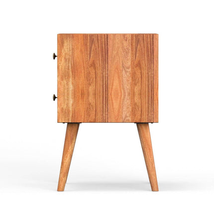 The MCM Bedside Table features a side view of its mid-century design with two legs and round knobs on the door. Made from solid mango wood, it has a natural finish with visible grain patterns, and its geometric pattern enhances the modern look against a plain white background.