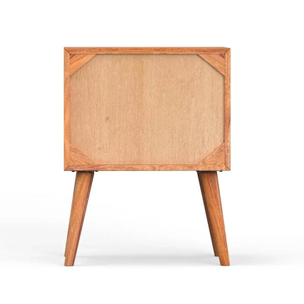 The MCM Bedside Table, crafted from solid mango wood, features a plain front panel and stands on four tapered legs, shown against a white background in a mid-century modern style.