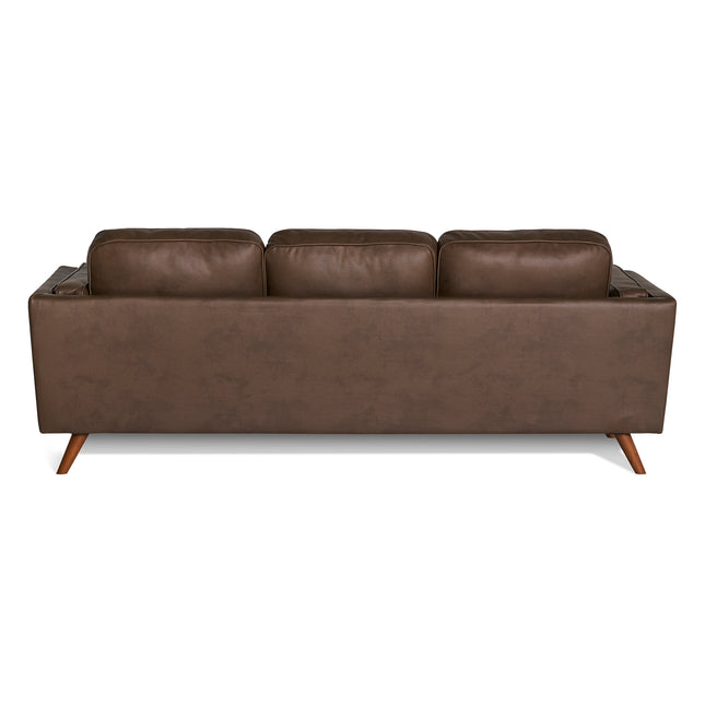 The Maddox Sofa features a back view of a brown leather design with three plush cushions and angled wooden legs, highlighting its mid-century modern style against a white background.