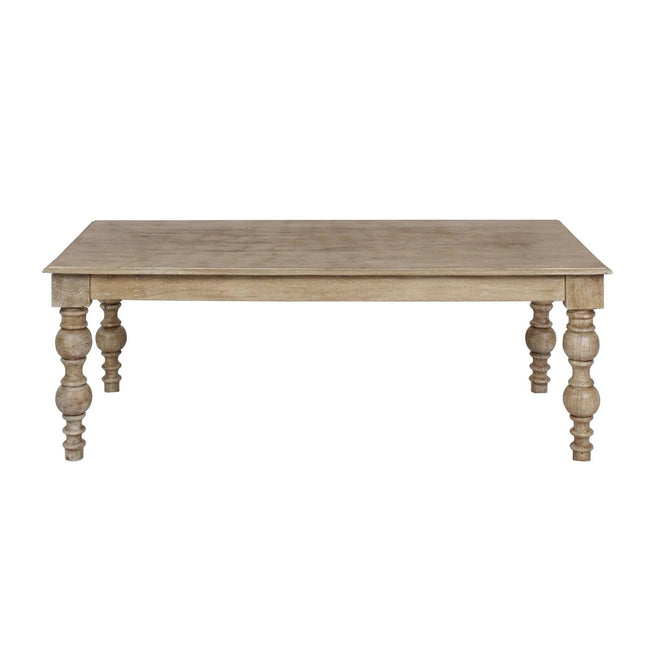 The French Country Coffee Table has a rectangular top and intricately carved legs. Made from solid mango wood, it features a distressed natural finish that offers classic, timeless charm.