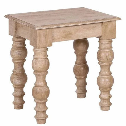 The French Country Side Table is a small, square-topped piece made from solid mango wood featuring ornate carved legs. Its distressed natural finish enhances its classic, elegant appearance, making it ideal for accentuating a French-country design.