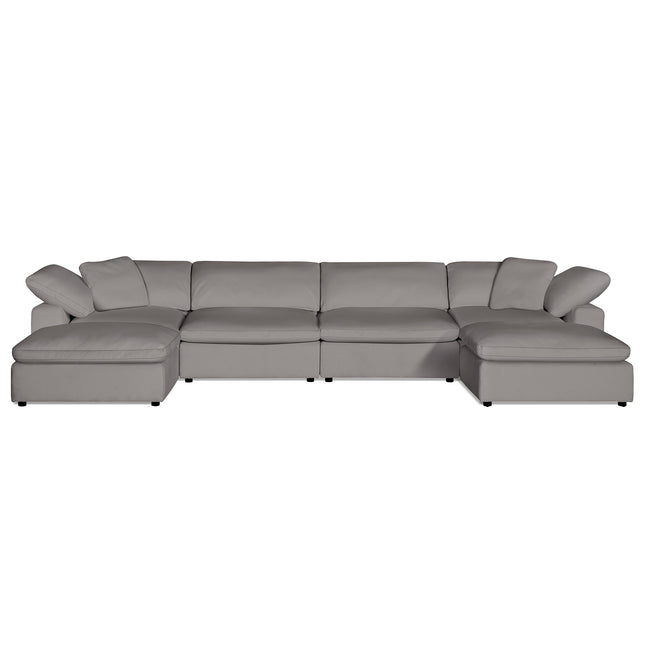 The Peyton 4 Piece Straight + 2 Ottomans is a luxurious, modern gray sectional sofa with plush down & feather cushions. Designed for comfort and style, it features smooth fabric and rests on dark, low-profile legs.