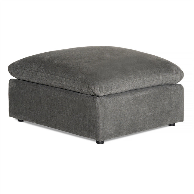 The My Cloud Slope 40 Ottoman features a square, modern design with dark gray fabric and low black feet, offering comfortable elegance. The plush top cushion, matching the base in color and texture, adds a serene touch to any space.
