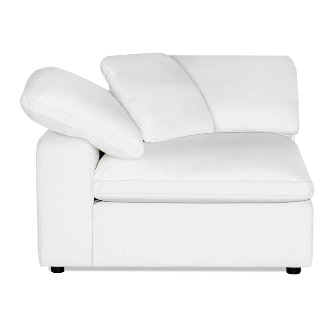 The white modern Peyton Corner sectional sofa features a low, plush seat and adjustable backrest cushions, perfect for modern living spaces. Its sleek, boxy design is similar to the Peyton Corner Chair and sits on small black legs against a plain white background.