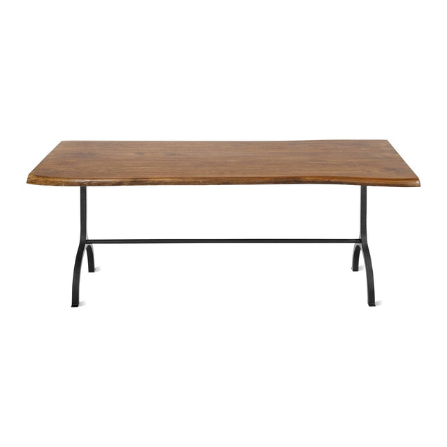 The Live Edge Foundry Dining Table is rectangular and crafted from natural acacia wood. It features a captivating live edge design with a sturdy black metal frame, four angled legs, and a horizontal support bar that enhance its rustic charm.
