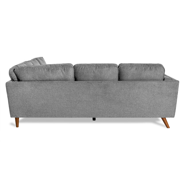 The Maddox Sectional, a modern gray fabric sofa with a mid-century vibe, features three cushions and rests elegantly on four wooden legs, making it perfect for any living room.