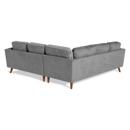 The Maddox is a gray, L-shaped sectional sofa with wooden legs. Its plush cushions are evenly spaced for a modern, comfortable appearance, perfect for any mid-century modern living room.