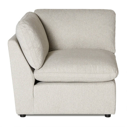 The My Cloud Corner is a versatile sectional in light gray upholstery, featuring padded backrest and seat cushions. It has a boxy structure with clean lines and a soft-textured fabric. Partially visible at the bottom are its black feet.