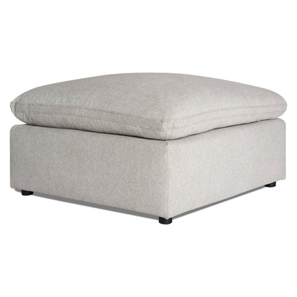 The My Cloud 40 Ottoman is a gray square piece with a cushioned top, solid base, and small black feet. Its soft fabric adds comfort and style to any room.