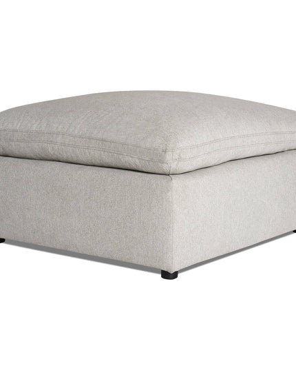 The My Cloud 40 Ottoman is a gray square piece with a cushioned top, solid base, and small black feet. Its soft fabric adds comfort and style to any room.