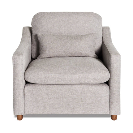 The My Cloud Slope Chair is a plush, light gray armchair with a matching seat cushion. It features contemporary design elements, soft curved armrests, and wooden legs, providing customizable comfort and style in a chic seating option.