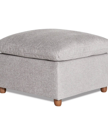 The My Cloud Slope 30 Ottoman, featuring a square design in light gray fabric with a cushioned top and wooden legs, offers comfortable furniture. Its simple, modern style is ideal for living room decor.