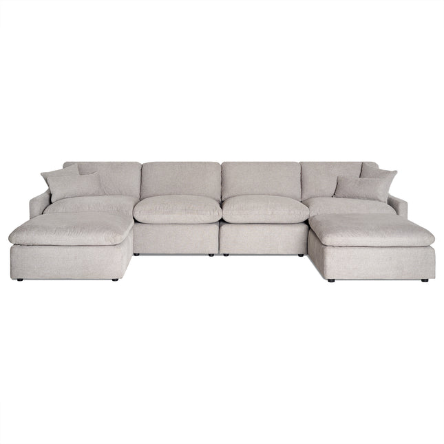 The My Cloud Slope 4 Piece Straight + 2 Ottomans is a large, light gray modular sectional sofa featuring plush cushions and armrests on each end. Its U-shaped design and small dark feet give it a clean, modern appearance, resembling the comfort of My Cloud.