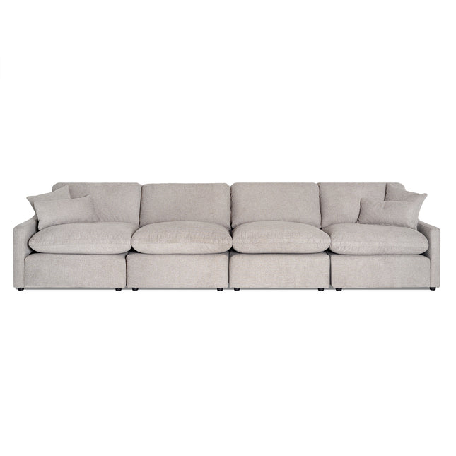 The My Cloud Slope 4 Piece Straight is a beige sectional sofa with a modern, minimalist design featuring four seats and matching cushions. Its soft fabric upholstery and rounded edges ensure exceptional comfort for any contemporary living space.