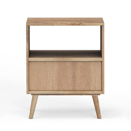 The Mango Geometric Nightstand is handcrafted from mango wood, featuring a minimalist design with an open top shelf, closed lower compartment, and four tapered legs. Its light finish adds bohemian flair, offering a natural and modern aesthetic.