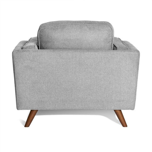 The Maddox Chair is a light gray fabric armchair showcasing a clean, mid-century modern design from the back. It features tapered wooden legs and plush backrest cushions, offering a minimalist yet elegant look akin to the Maddox Sofa Set.