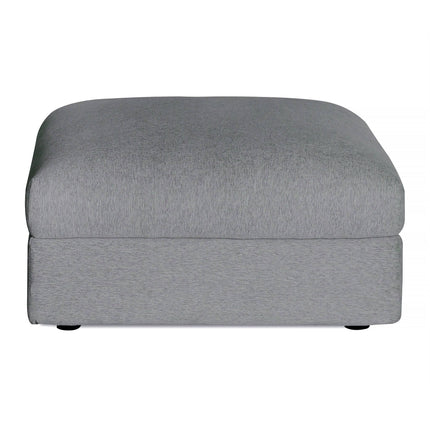 The Lugano Storage Ottoman in gray combines Italian luxury and modern design with a smooth fabric surface, subtle texture, thick cushion, and small round legs, crafted from premium materials.