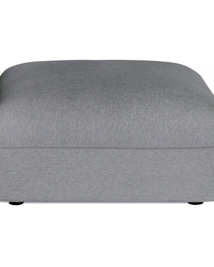 The Lugano Storage Ottoman in gray combines Italian luxury and modern design with a smooth fabric surface, subtle texture, thick cushion, and small round legs, crafted from premium materials.