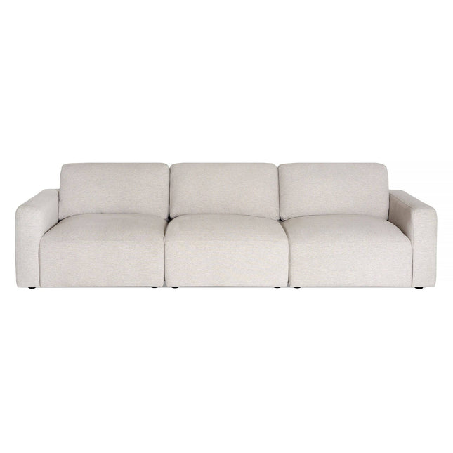 The Lugano is a modern three-seater sofa with Italian luxury, featuring a light beige hue, plush cushions, and a minimalist design. Its clean lines, wide seating, thick square arms enhance its contemporary vibe, while discrete black legs offer subtle support.