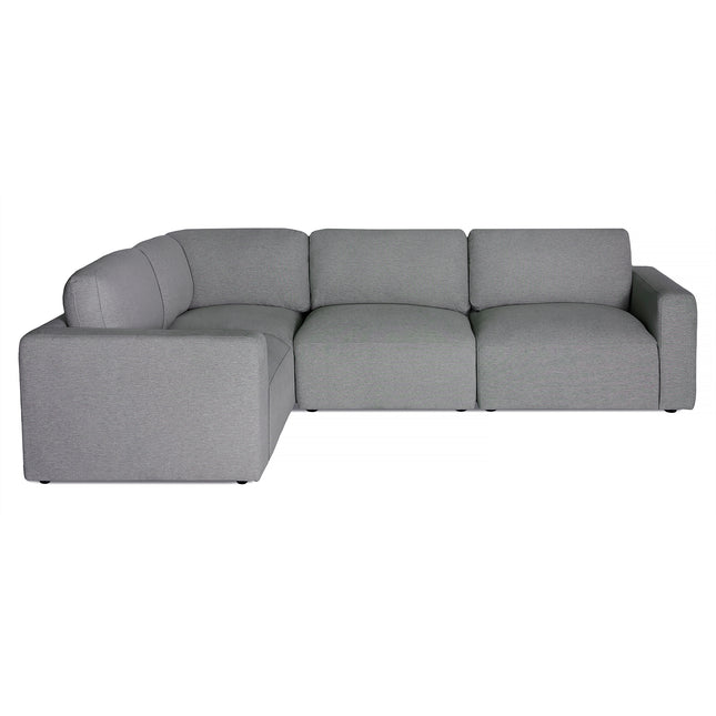 The Lugano 4 Piece Left L is a modular gray sectional sofa with an L-shape design, featuring plush cushions and crafted with premium materials. It showcases Italian luxury through its modern, minimalist style, clean lines, and low-profile armrests on a plain white background.