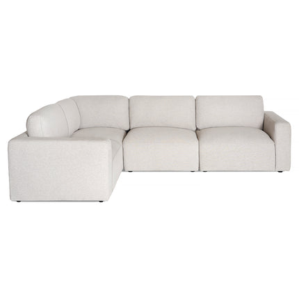 The Lugano 4 Piece Left L is a light beige, L-shaped sofa with plush seats and backrests. Its modern design features low-profile armrests and clean lines, offering Italian luxury in premium materials, perfect for contemporary living spaces.