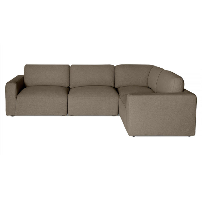 Meet the Lugano Sectional: a luxurious, modern L-shaped sofa with sleek lines, square cushions, and deep seating. Upholstered in muted beige fabric, this Italian piece features plush cushions and a low backrest, perfect for contemporary living spaces.