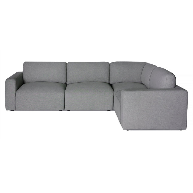The Lugano Sectional boasts a modern minimalist design in gray, offering plush cushions and three connected seats with a right-side extension. Its sleek upholstery and low-profile legs exemplify Italian luxury, fitting seamlessly into contemporary spaces.